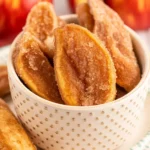 Crispy Air Fryer Apple Fries with cinnamon sugar coating and dipping sauce.